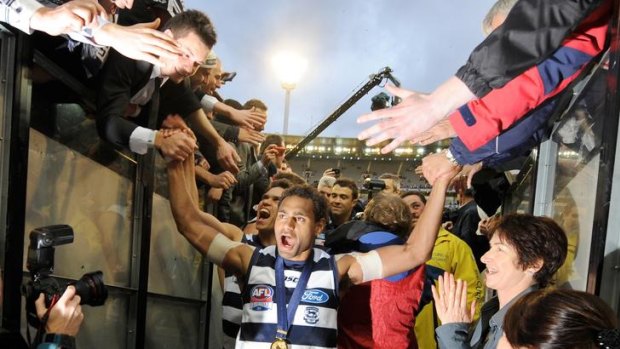 Geelong's Travis Varcoe celebrates after the 2011 grand final.