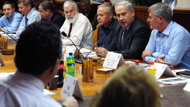 Defiant ... Israeli  Prime Minister Benjamin Netanyahu (2nd-L) addressing the national economy emergency committee.