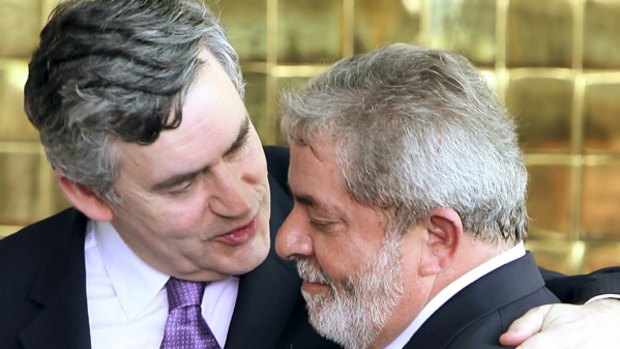Gordon Brown consoles Luiz Inacio Lula da Silva. PICTURE: REUTERS