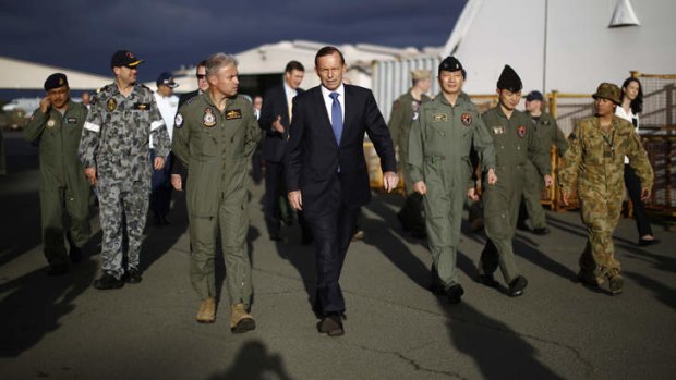 In step: Tony Abbott with Australian and international military personnel at RAAF Base Pearce during his Senate election campaign visit to Western Australia.