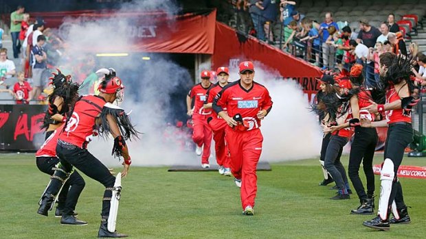 On fire: Aaron Finch leads out the Renegades.