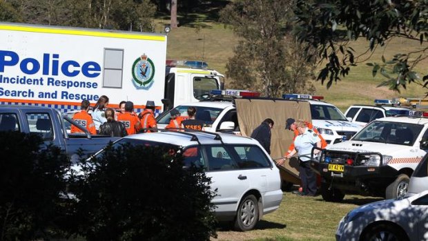 Police and SES volunteers search for Ethan Gordon earlier today.
