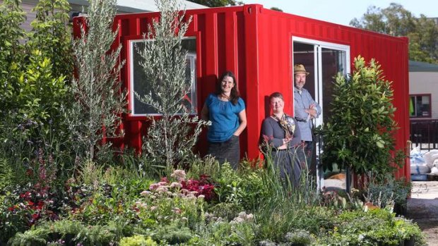 Showpiece: Jenny McCoy, Claire Farrell and John Rayner with a shipping container they are turning into a garden.