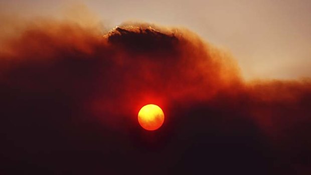 The sun glows through smoke haze at Lake Repulse, 80km north-west of Hobart.