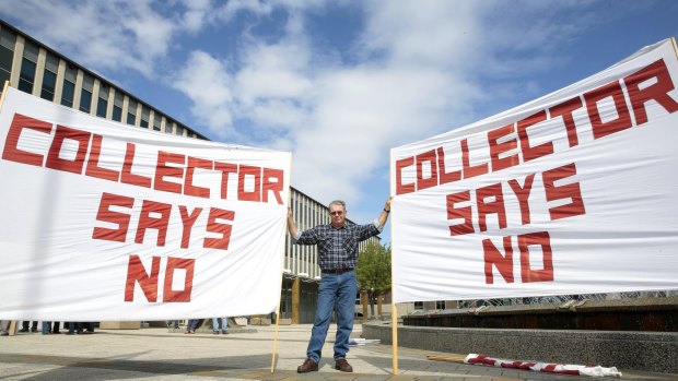 Terry Lovelock from Collector protests out the front of the ACT Legislative Assembly.