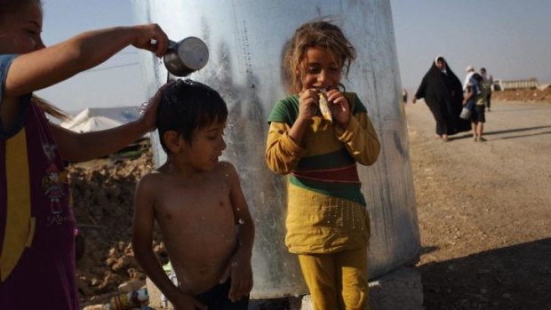 Children at a refugee camp housing families from Mosul which has been under the control of Islamic State of Iraq and the Levant (ISIL) militants for one week now.