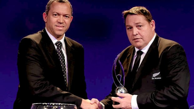 Steve Hansen (R), head coach of New Zealand, receives the Team of The Year award.