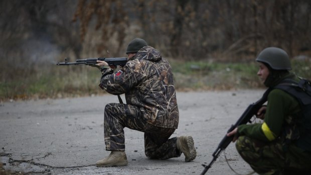 Ukrainian volunteer fighters  on patrol in the village of Peski near Donetsk, eastern Ukraine.