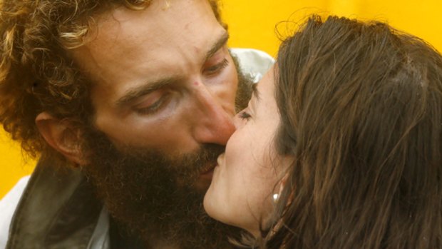 Salty kiss: Alexandro Bellini is reunited with  wife Francesca at Newcastle Harbour after his Peru-to-Australia crossing was aborted.
