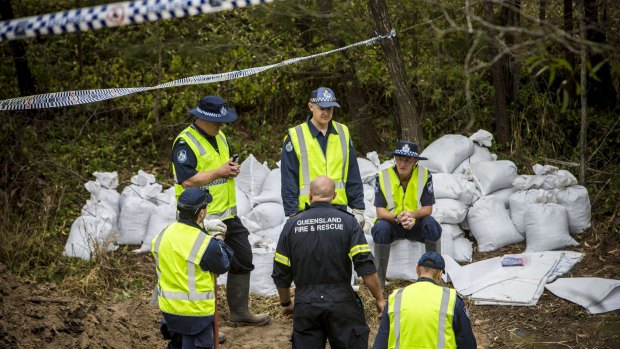 Police search a drain in hope of finding the remains of Sharron Phillips.