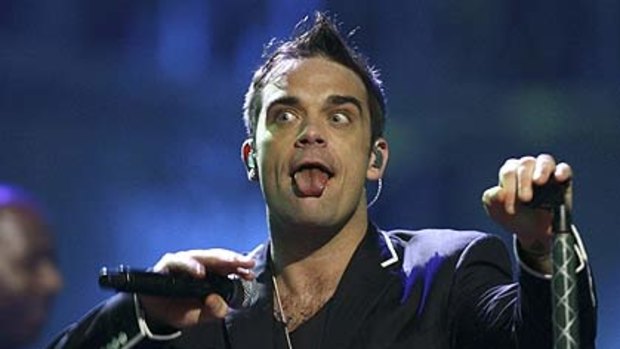 Robbie Williams ... getting back with the band.