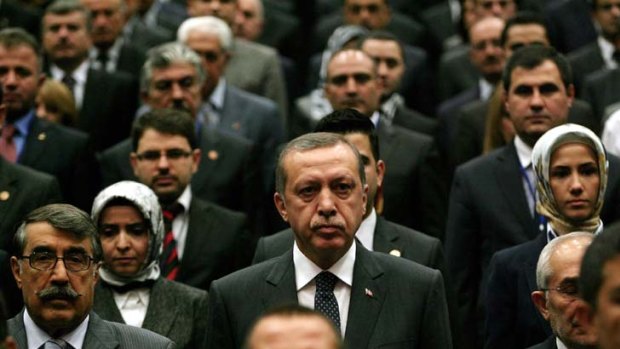 Man for the times ... Recep Tayyip Erdogan centre, among Justice and Development Party (AKP) members at a party meeting.