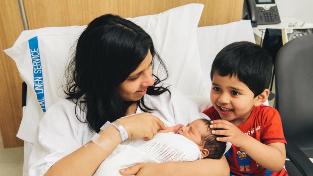 Erandi Kulasekera with her two sons, Methuka Mohottala, 3, and her two-day-old unnamed newborn at the Canberra Hospital.