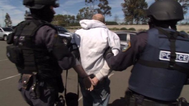 Busted: Police arrest a man in Sydney accused of making and supplying lethal pen guns.