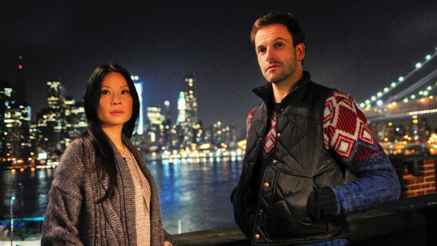 Fish out of water ... Lucy Liu as the innovatively female Watson and Jonny Lee Miller as Holmes.
