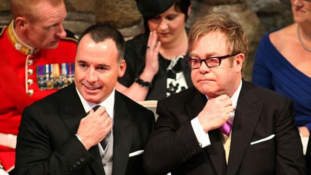 Elton John, right, and his partner David Furnish at the royal wedding.