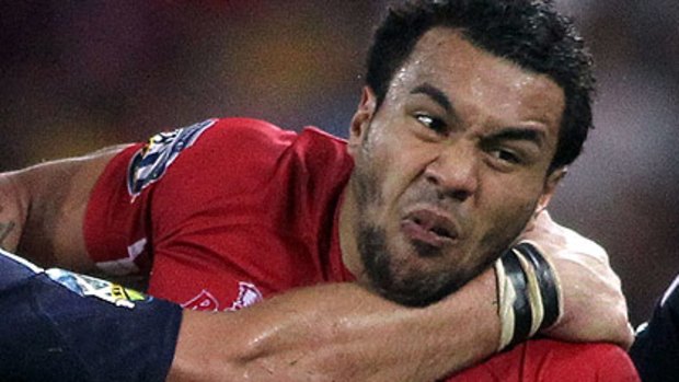 Determined ... Queensland winger Digby Ioane forces his way forward against the Stormers.