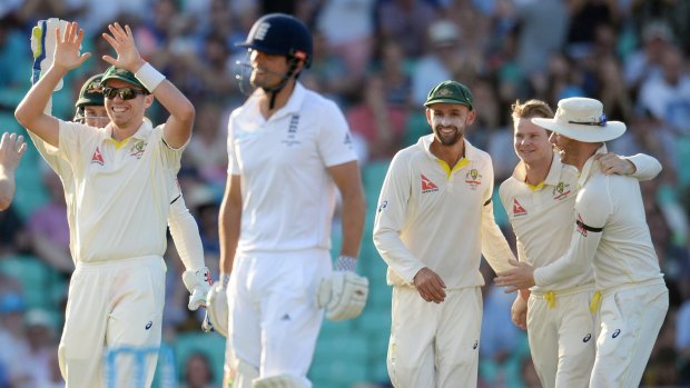 Crucial wicket: Nathan Lyon and Michael Clarke congratulate Steve Smith after the dismissal of England's Alastair Cook.