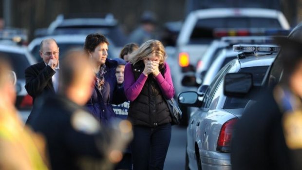 Residents grieve following the shooting at Sandy Hook Elementary School.