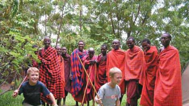 Masai warriors in Kenya are happy to share customs with these boys on a Peregrine Family Adventures Worldwide trip.