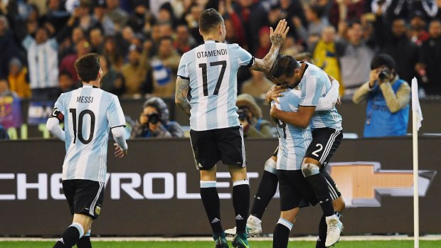 Winner: Argentina celebrate after Gabriel Mercado's goal. 