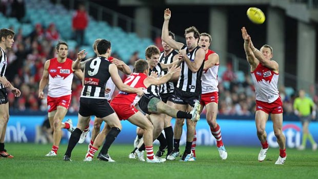 From the middle of a pack, Dane Beams effects a clearance.