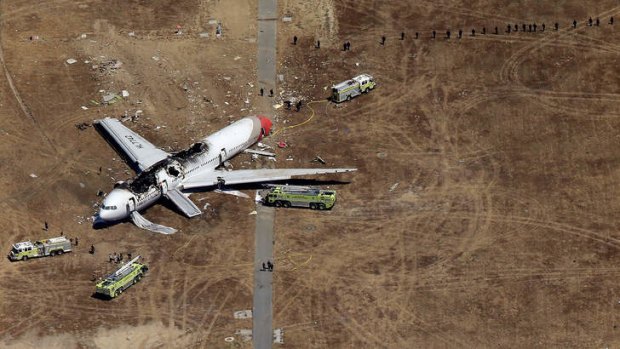 The Asiana Boeing 777 lies wrecked on the runway at San Francisco International Airport. Despite several fatal incidents, 2013 was the safest year on record for air travel.