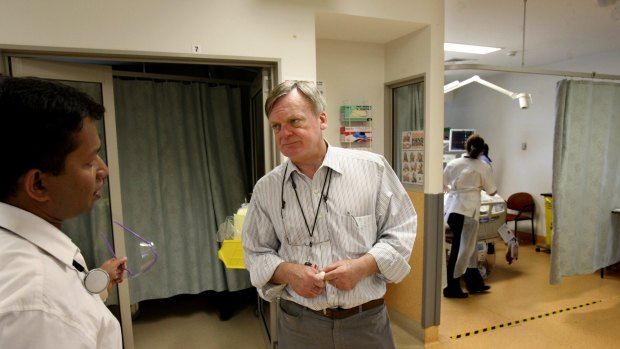 Early intervention the key: Professor Ken Hillman talks to a colleague at the Campbelltown Public Hospital intensive care unit.