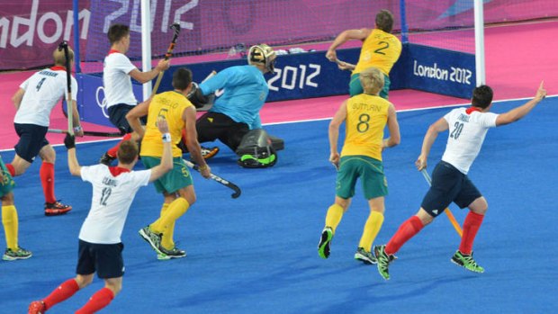 Leveller ... James Tindall (right) of Great Britain celebrates after scoring a late equaliser to salvage a 3-3 draw with the Kookaburras.