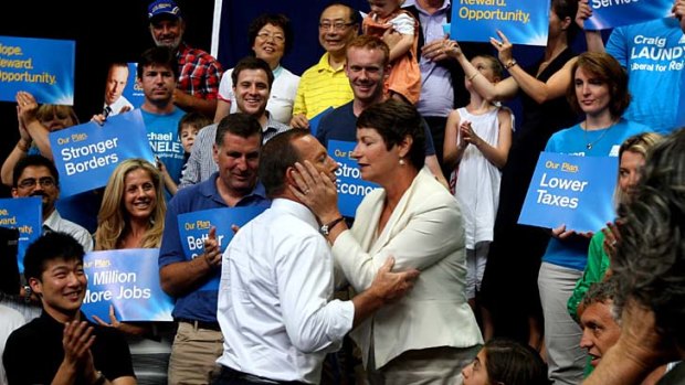 Devoted &#8230; Tony Abbott and his wife, Margie, with supporters during a rally on Sunday at Auburn Basketball Centre.