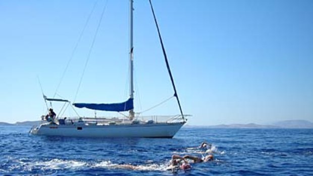 In the deep end ... the group swims beside the yacht Katerina.
