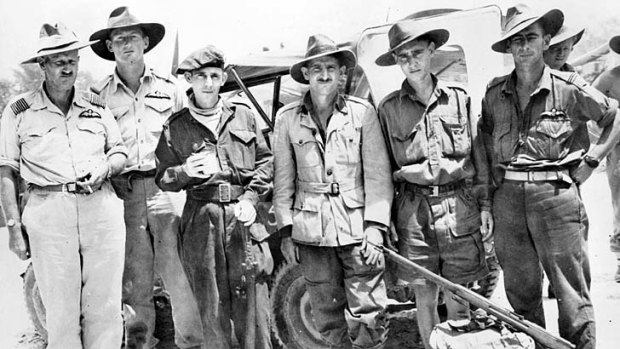 Survivors' story &#8230; three Australian prisoners of war (centre) flanked by RAAF officers who helped liberate them.
