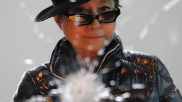 Anti-gun violence advocate Yoko Ono stands in front of her art piece <i>A Hole</i>.