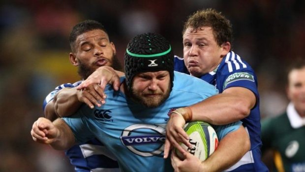 Carrying his weight: NSW prop Benn Robinson makes inroads against the Stormers.