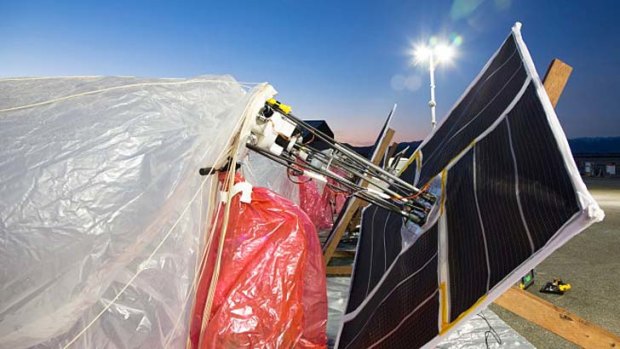 Solar panels and insulated electronics packages, prepared for launch.