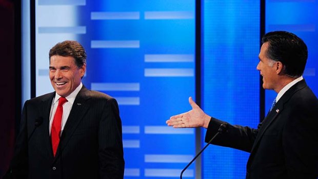 Gaffe ... Mitt Romney, right, offers Rick perry a $US10,000 bet.