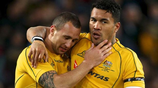 Trump card ... Digby Ioane with Quade Cooper after scoring last night.