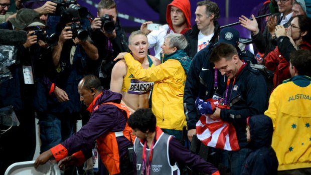 Sharing the victory ... Sally Pearson heads into the stands to celebrate with her coach Sharon Hannan.
