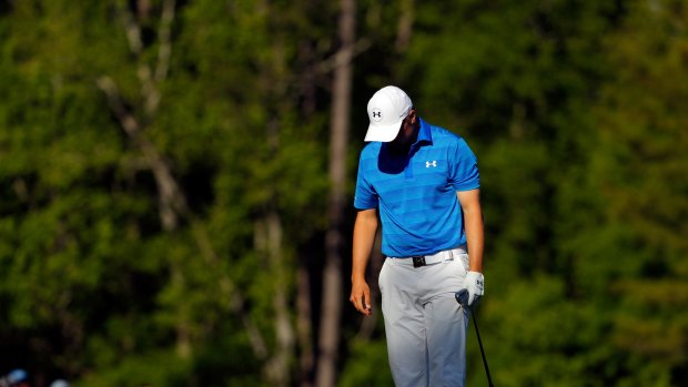 Jordan Spieth reacts after hitting his tee shot into the water on the 12th.