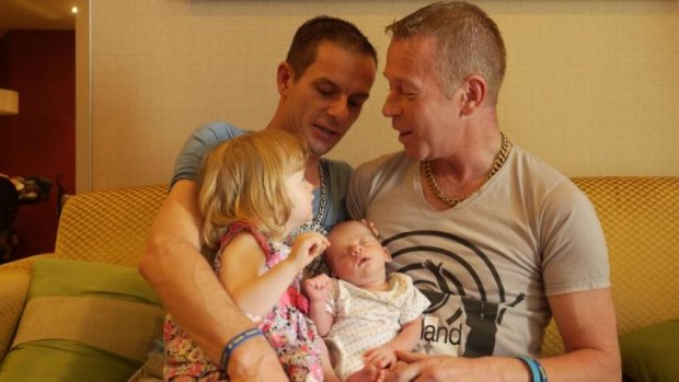 James, left, and Steven with Rhyley and two-year-old daughter Aleisha, in Bangkok.