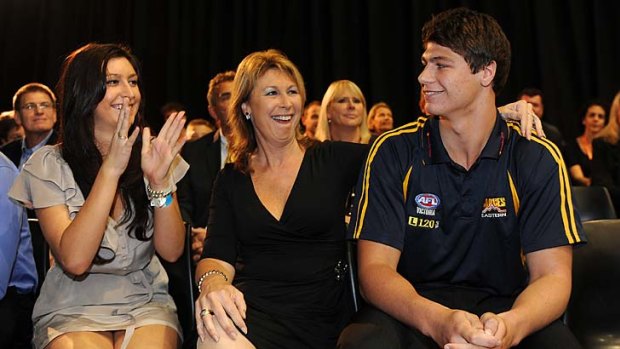 No.1 draft pick Jonathan Patton is congratulated by his sister Lauren and mum Belinda.