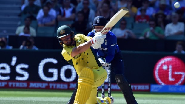 Aaron Finch slashes a boundary at the MCG. He was run out for 135.
