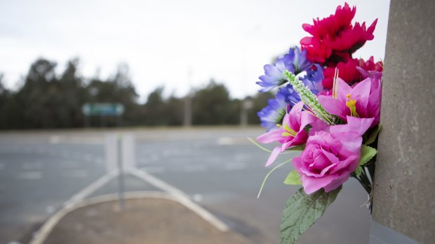 Flowers left on a pole as a memorial for the fatality that happened on Wednesday night.