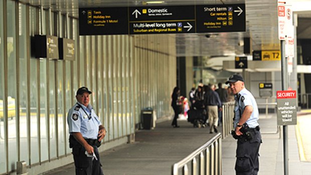 Federal police at Melbourne Airport. There are fears that security tasks such as video surveillance are falling through the cracks at airports.