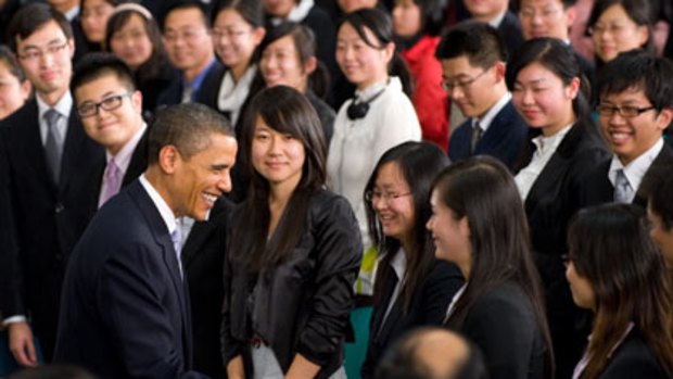’’Government should reflect the will of the people’’ ...  Barack Obama greets his audience before a speech in Shanghai that few Chinese would be able to hear or see.