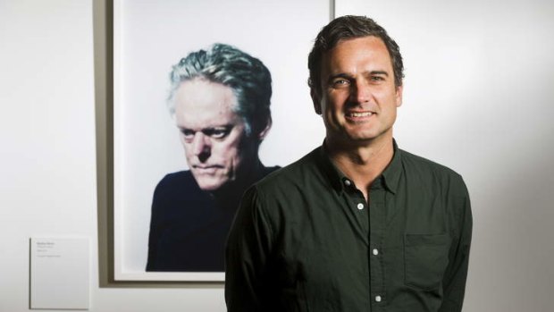 Andrew Cowen with his winning portrait of cartoonist Matthew Martin.