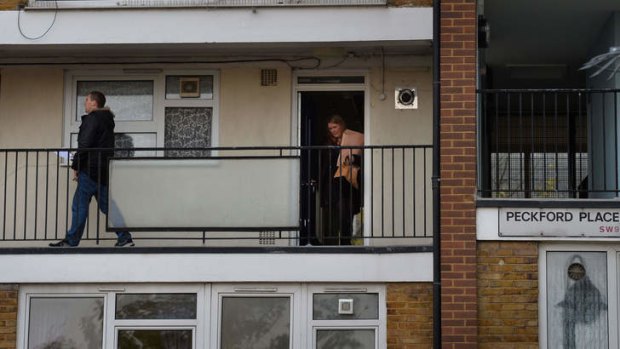 Police conduct house-to-house enquiries at neighbouring flats.