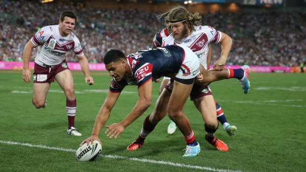 Manly's David Williams fails to stop Daniel Tupou of the Sydney Roosters scoring in the NRL grand final.
