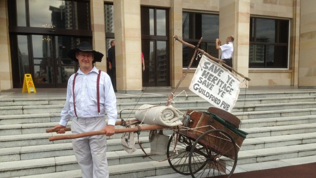 Guildford resident Andrew Kiely protests at Parliament House.
