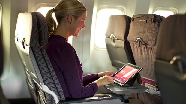 Qantas will provide iPads to both business and economy class passengers for inflight entertainment on its Boeing 767s.